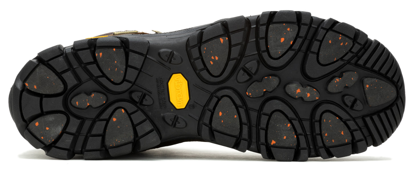 The sole of a black shoe shows a lugged pattern with orange flecks throughout.
