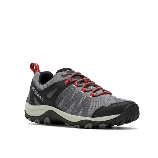 A gray and black hiking shoe with red laces.