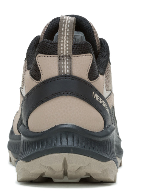 Back view of tan and black athletic shoe with "MERRELL" text.