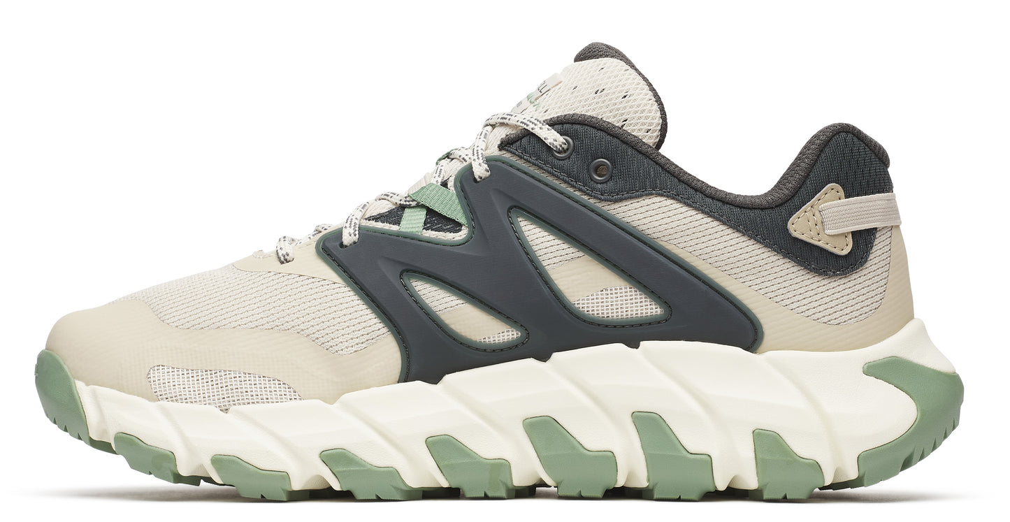 Beige and gray trail running shoe with a sculpted white and green sole.