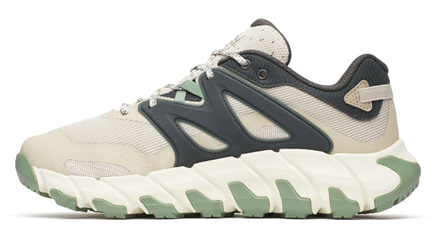 Beige and gray trail running shoe with a sculpted white and green sole.