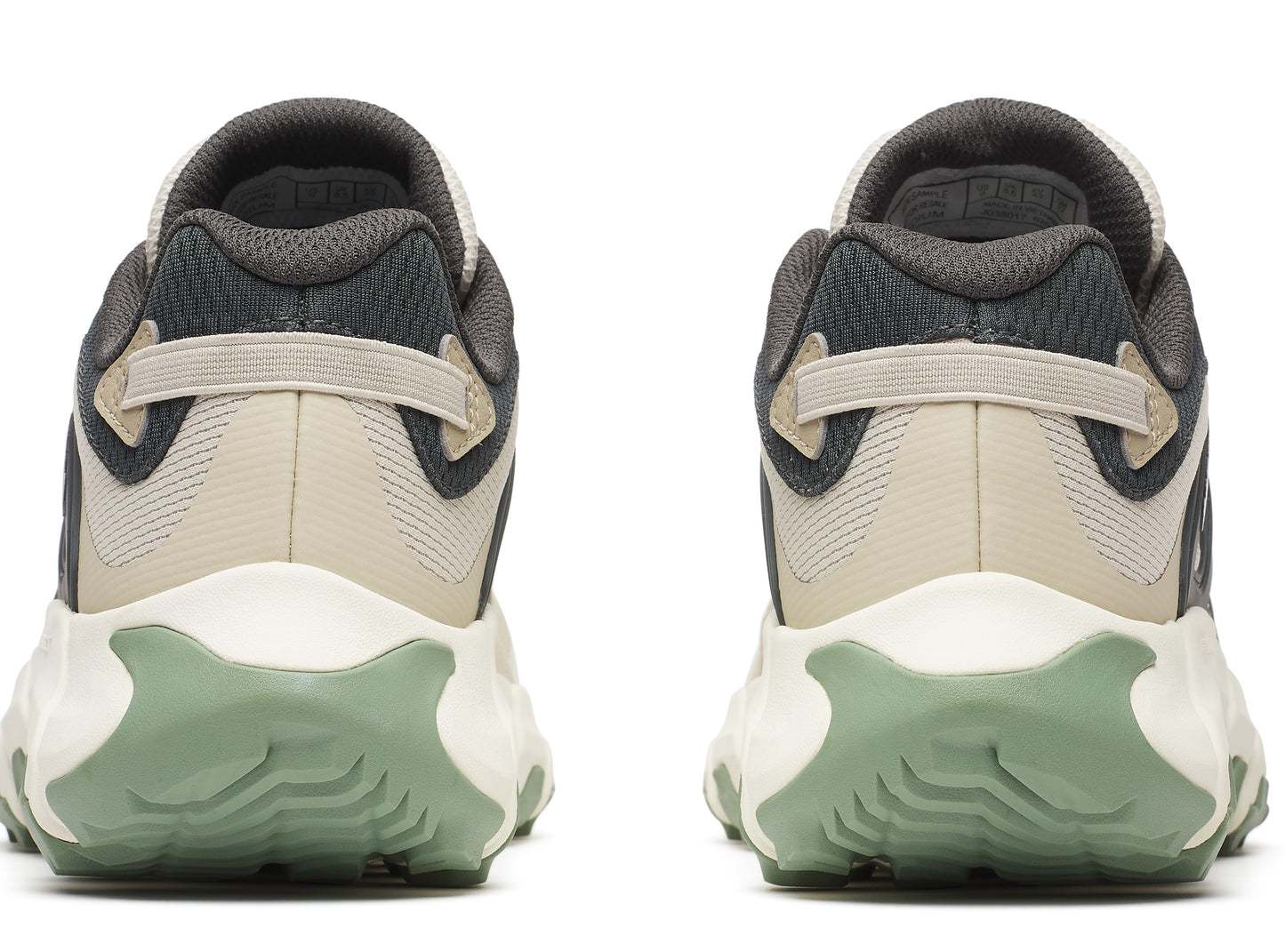 Pair of sneakers viewed from the rear, featuring beige and grey uppers, white midsoles and light green textured soles.