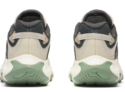 Pair of sneakers viewed from the rear, featuring beige and grey uppers, white midsoles and light green textured soles.
