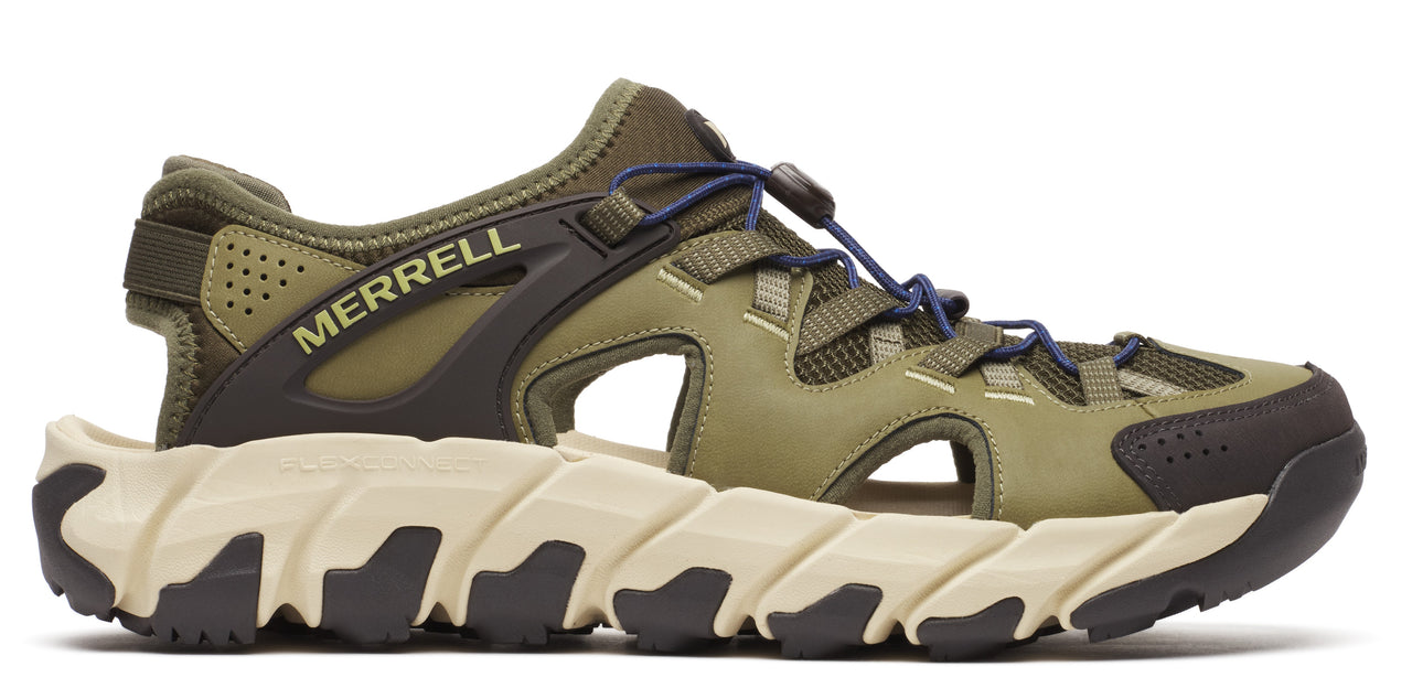 A green hiking sandal with a light-colored ridged sole.