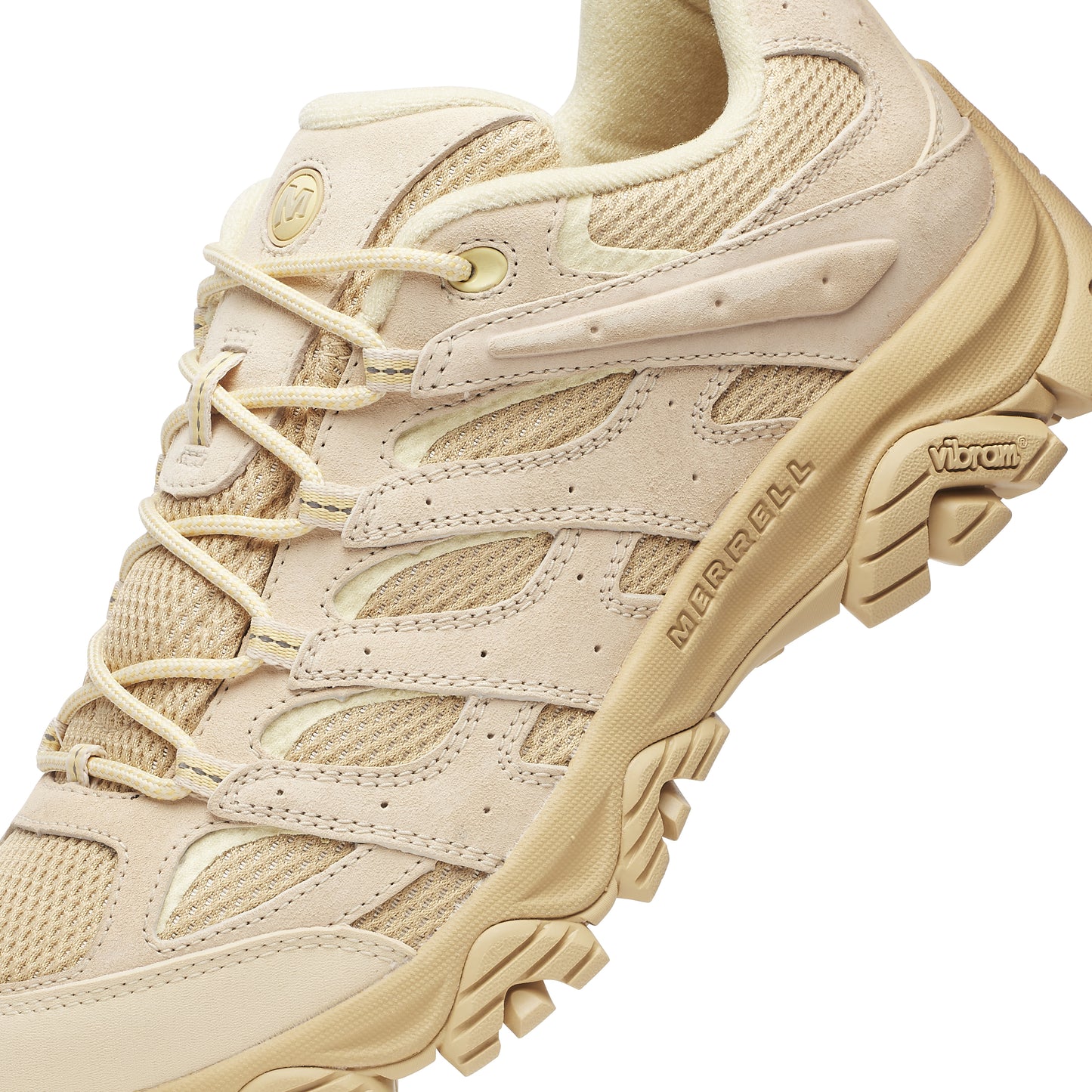 beige athletic shoe with laces and thick tread; "MERRELL" visible on the side.