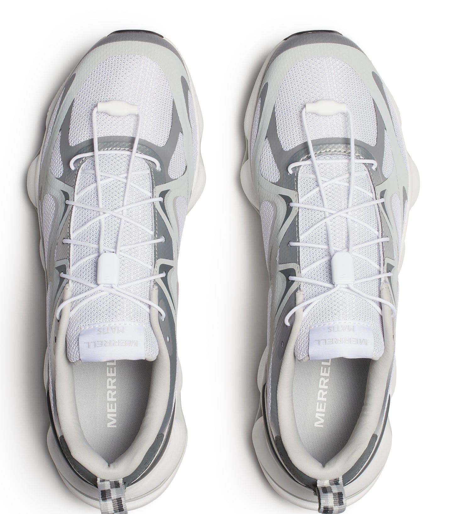 Overhead view of two white and gray athletic shoes with white laces.