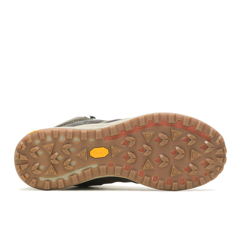 sole of a hiking shoe featuring lug treads in a triangular pattern and a yellow vibram logo