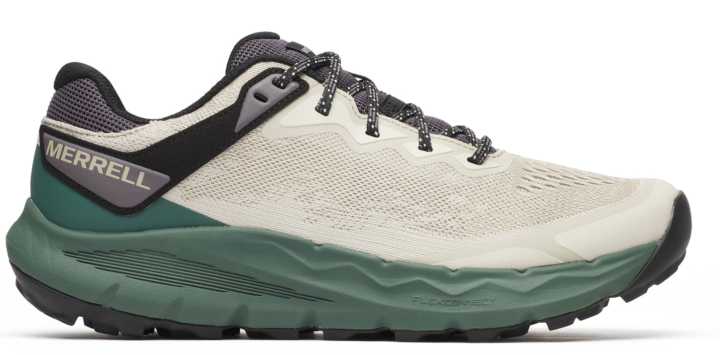 Side view of a shoe with a gray and black heel, a tan upper, and a green sole.