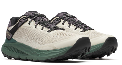 Pair of low-rise athletic shoes with light beige breathable uppers, black and white patterned laces, dark gray tongue, dark green sole and heel accent.