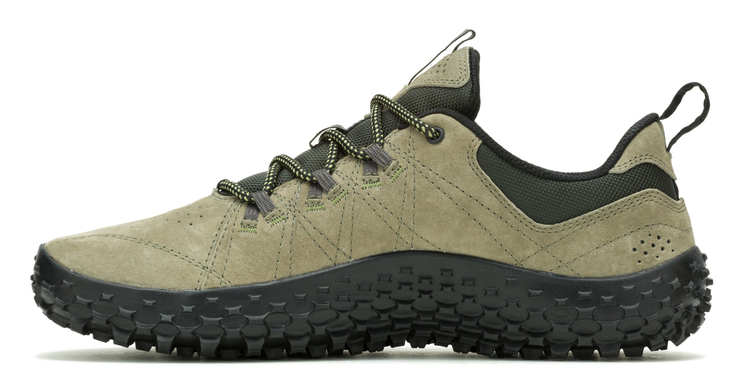 Olive green suede sneaker with a lugged black sole and a decorative geometric design on the upper.