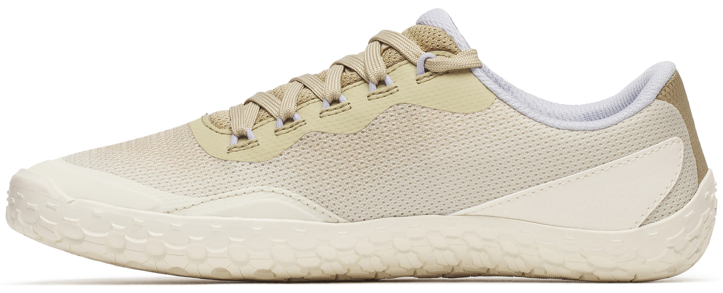 Beige shoe with laces and a patterned sole.