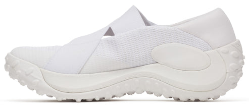 A white athletic shoe with a thick sole and a cross-strap design.