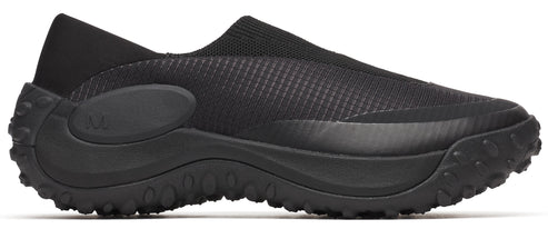 A black slip-on shoe with a knit upper and a chunky, lugged sole.