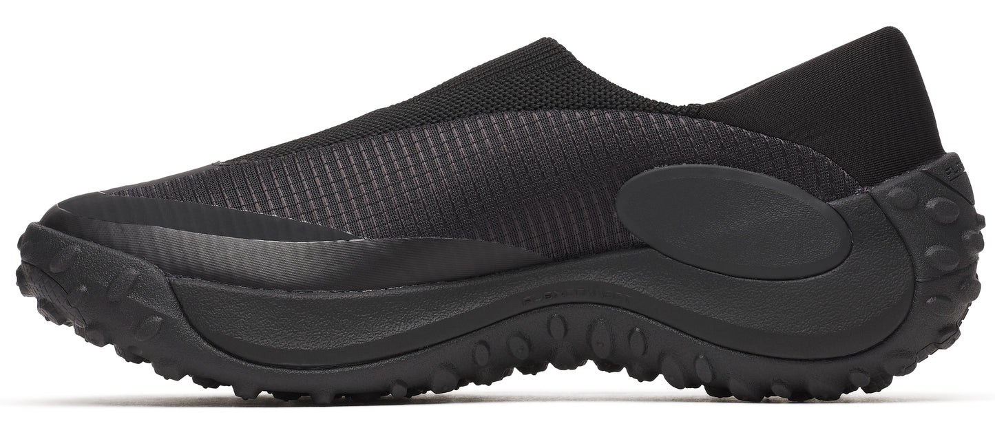Black slip-on shoe with a thick treaded sole.