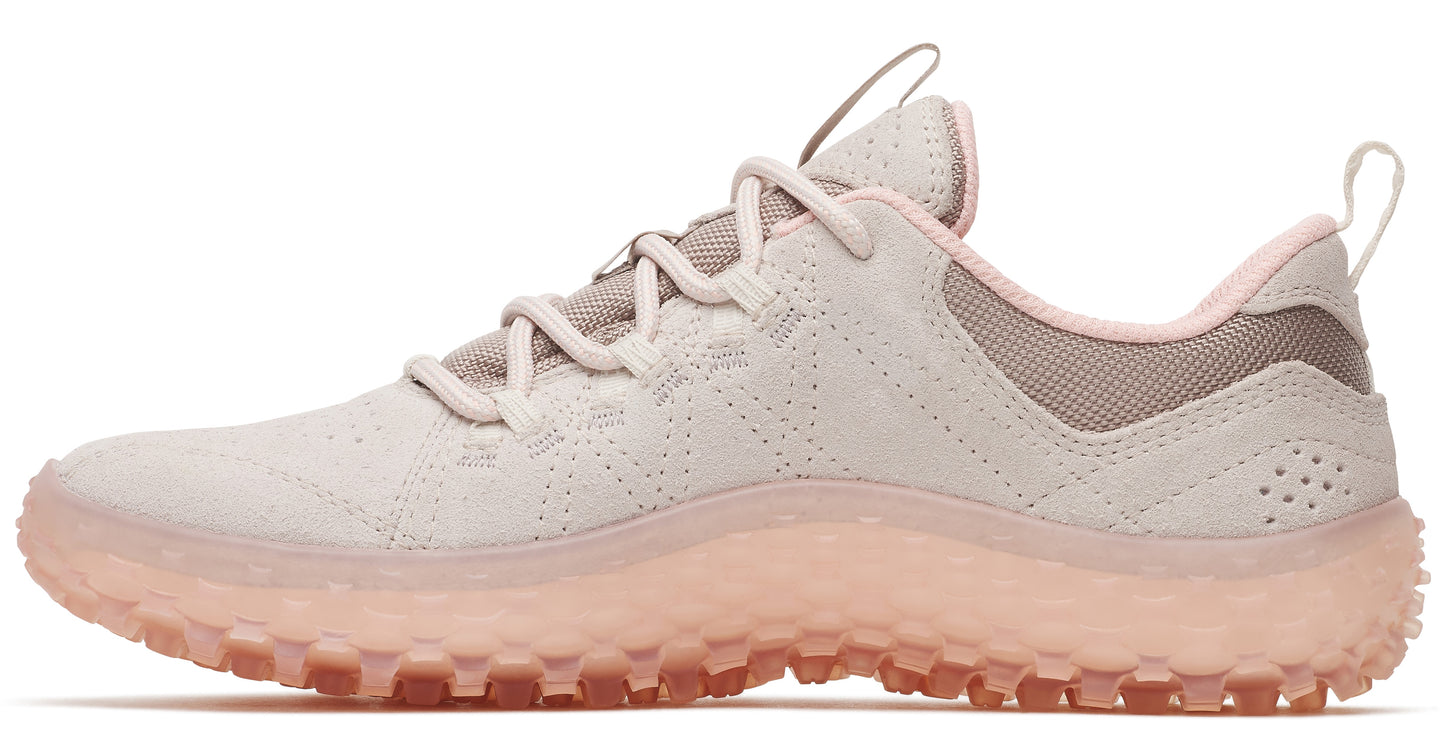 A light tan low top sneaker with a translucent textured pink sole.
