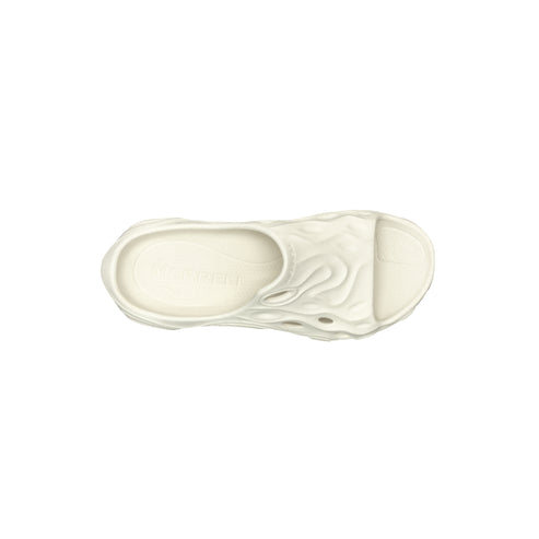 Top-down view of a light cream-colored, sculpted slip-on sandal.