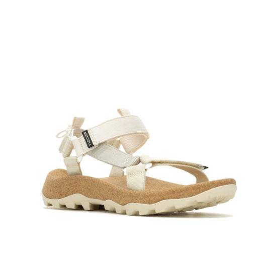 White sandals with tan cork soles and multiple adjustable straps.