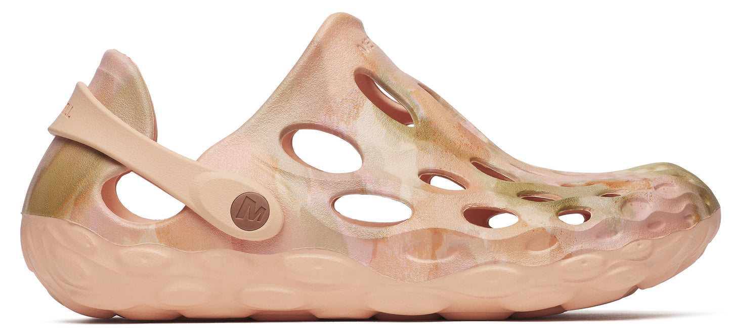 Peach-colored clog-style shoe with a perforated upper and a rotating back strap.