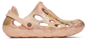 Peach-colored clog-style shoe with a perforated upper and a rotating back strap.