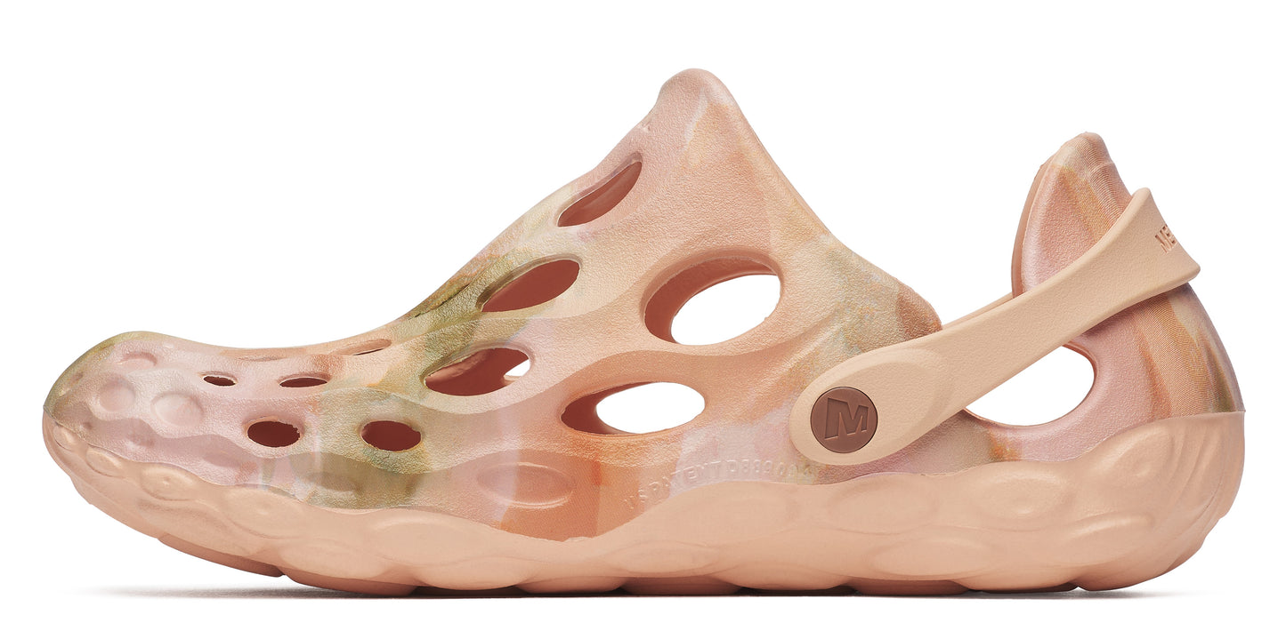 Peach-colored clog-style shoe with an adjustable heel strap and ventilation holes.