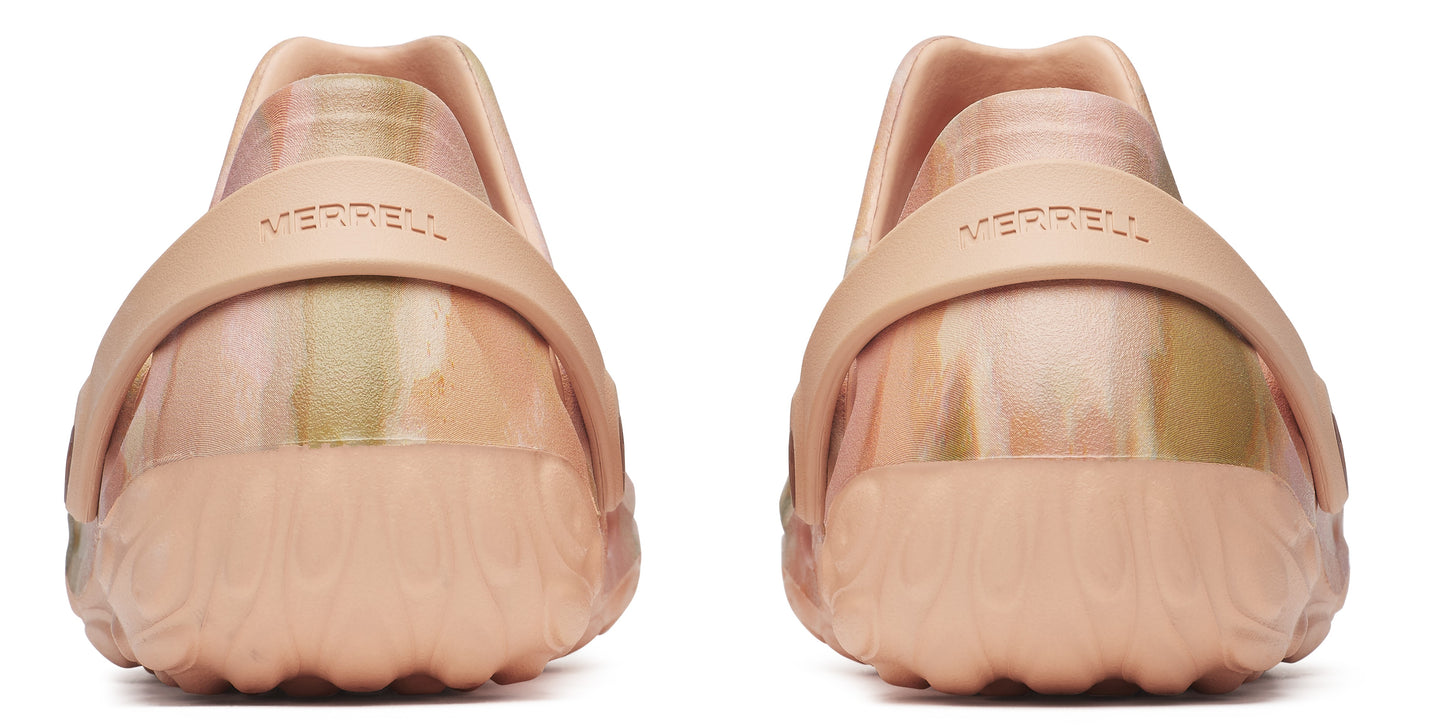 Pair of salmon colored slip-on shoes with a rounded toe and strap across the back.