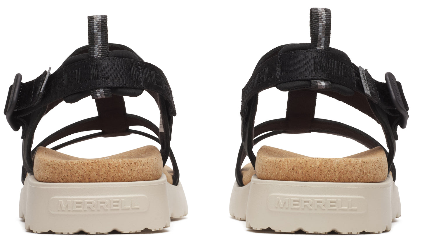 Rear view of two sandals, thick white sole, cork insole, black straps, and a visible text 'MERRELL'.
