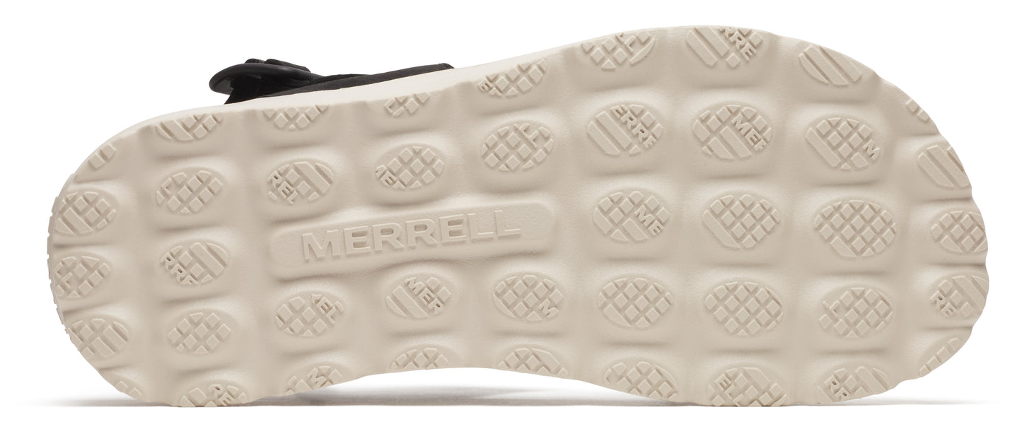A sole with a repeating circular texture and the word "MERRELL" in the center.