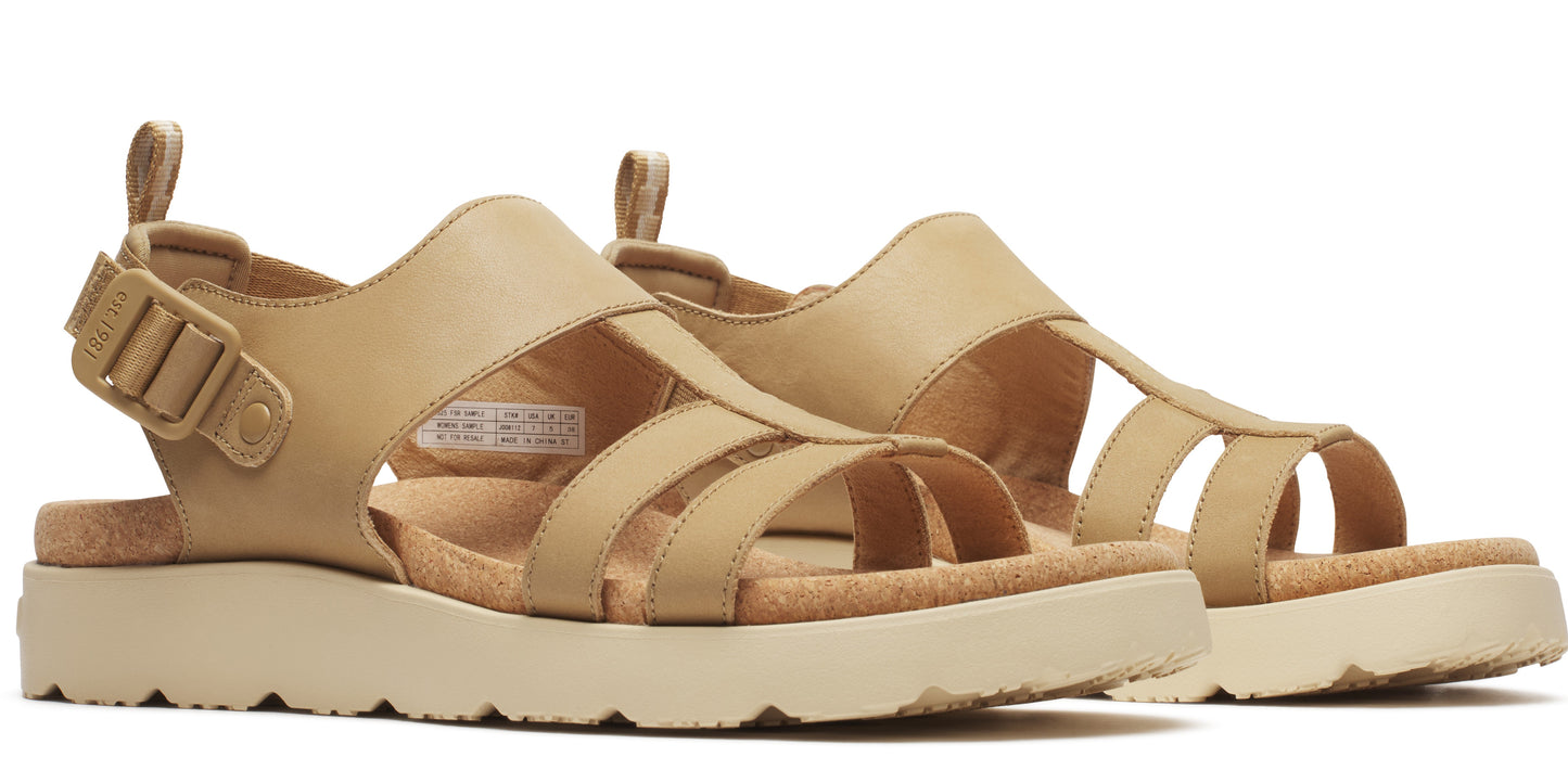 A pair of tan, platform sandals with an adjustable buckle strap.