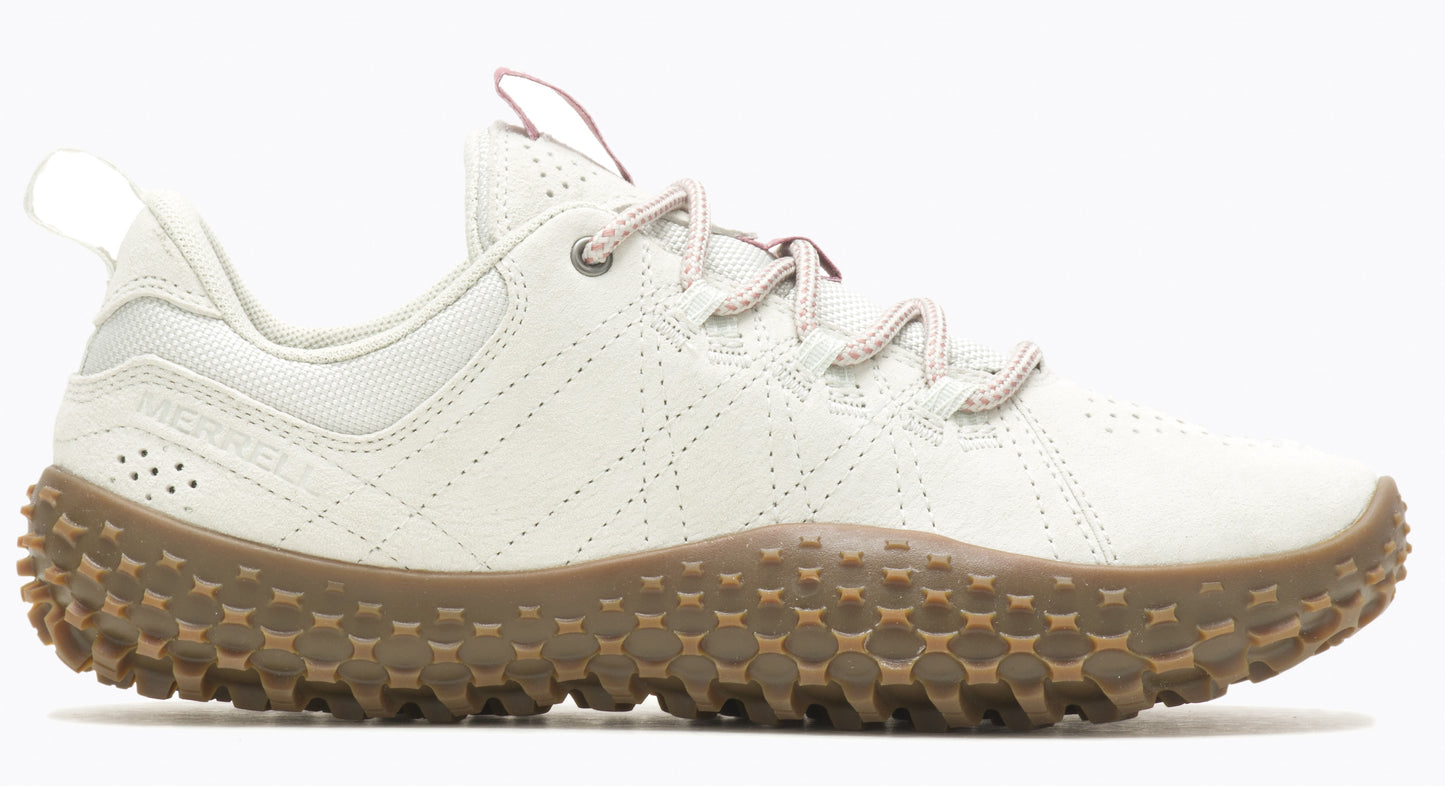 Low top cream colored sneaker with tan rugged sole.