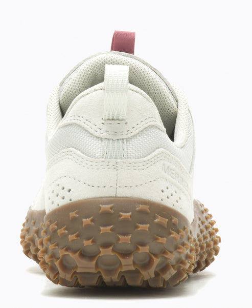 Back view of a white low-top sneaker with a brown patterned sole and a red loop.