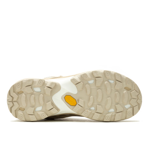 Tan shoe sole with repeating tread patterns and a yellow hexagon.