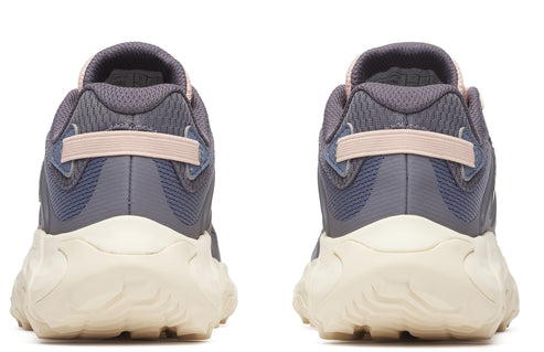 Two athletic shoes with gray mesh uppers, pink heel straps, and off-white textured soles, seen from the back.