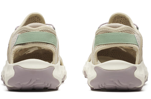 Back view of two sandals with tan uppers, light green heel straps, and lavender soles.