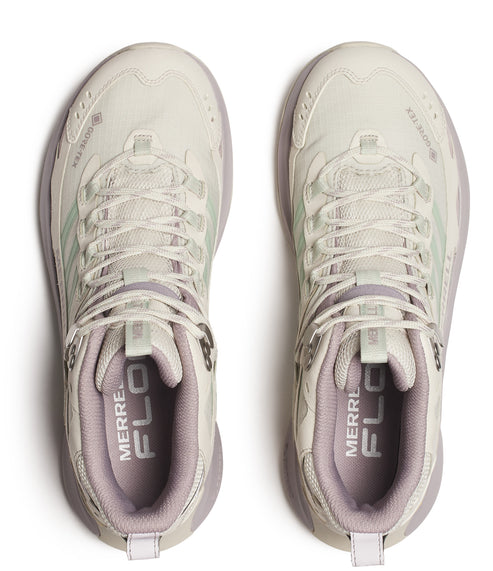 Two off-white hiking shoes with GORE-TEX branding, laces, and FLOW text on the inner sole.