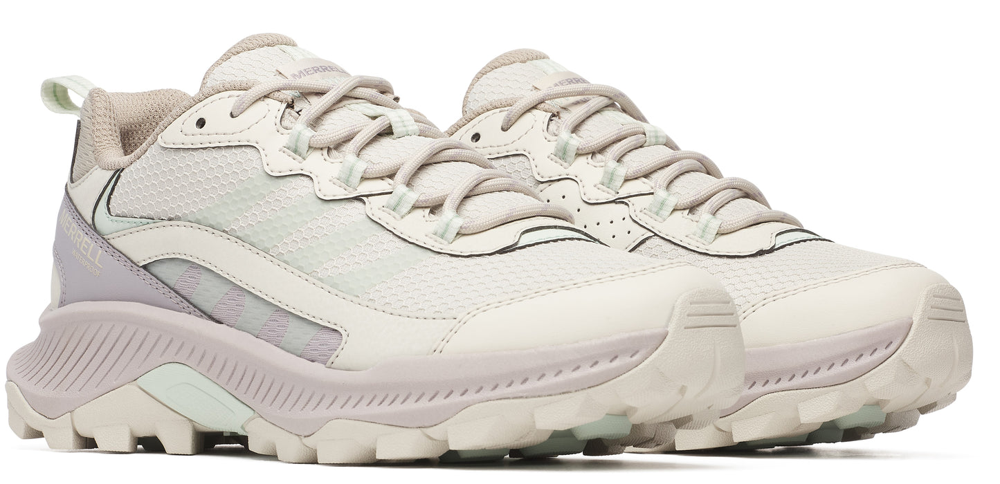 A pair of low-top, light gray athletic shoes with textured soles and lace-up closure.