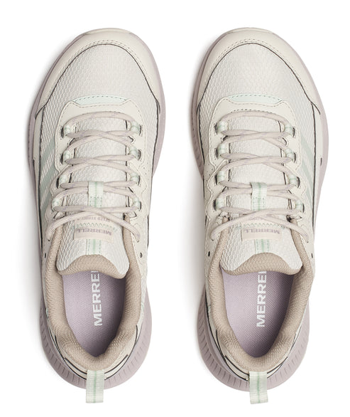 Top-down view of two light beige athletic shoes with visible laces and the text 'MERRELL' inside.