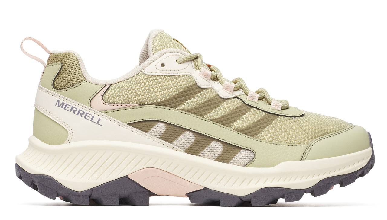 Low-top trail shoe with green mesh upper, beige accents, and MERRELL logo on the side.