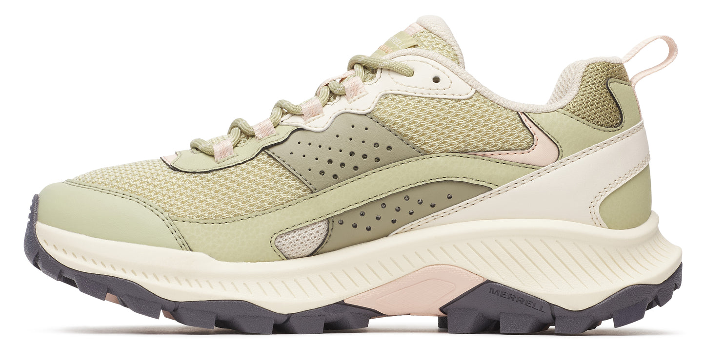 Trail running shoe, light green with off-white accents and lugged outsole.