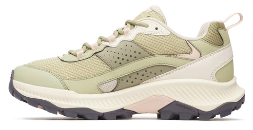 Trail running shoe, light green with off-white accents and lugged outsole.