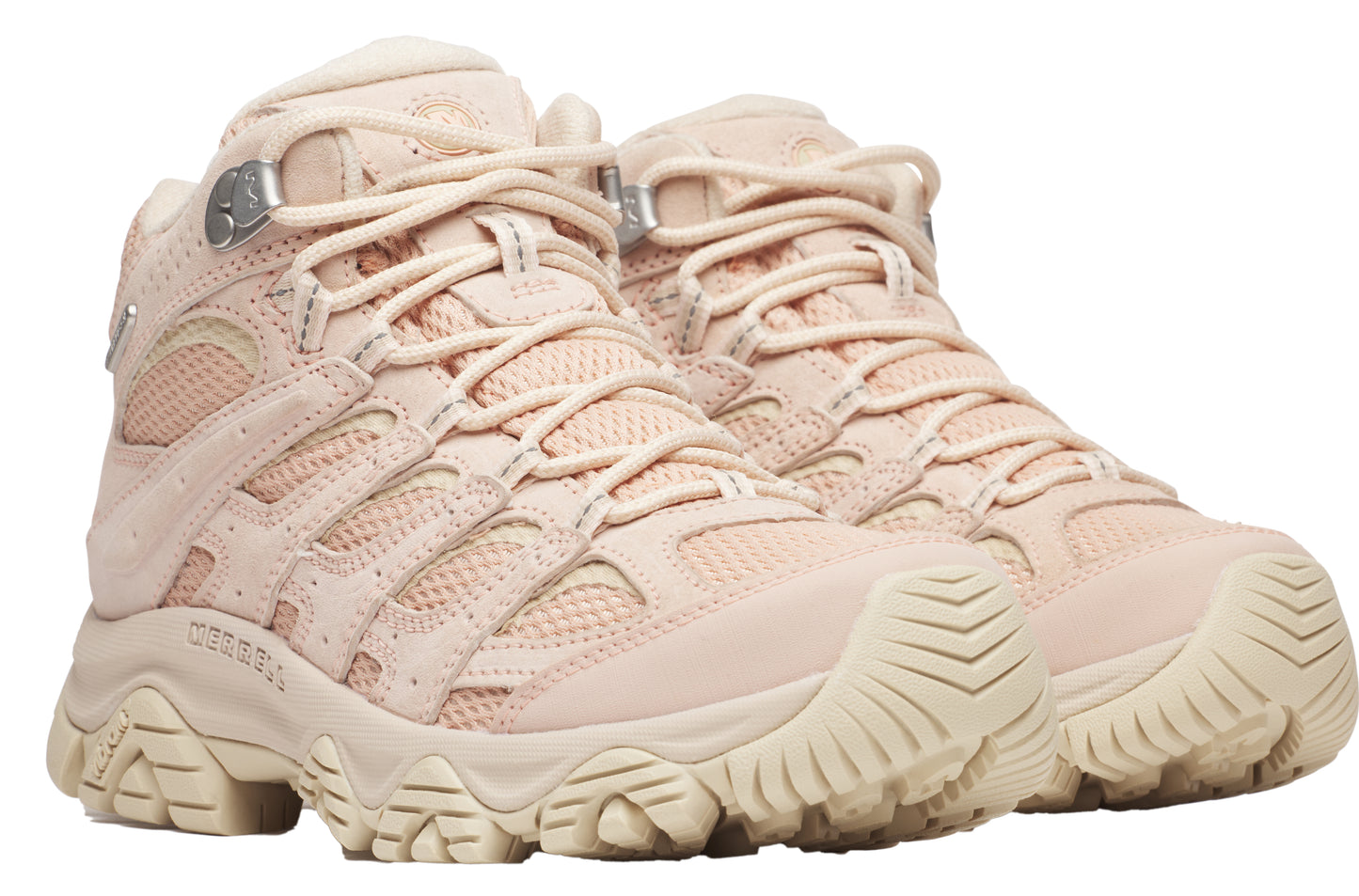 A pair of beige hiking boots with a thick, ridged sole and lace-up closure.