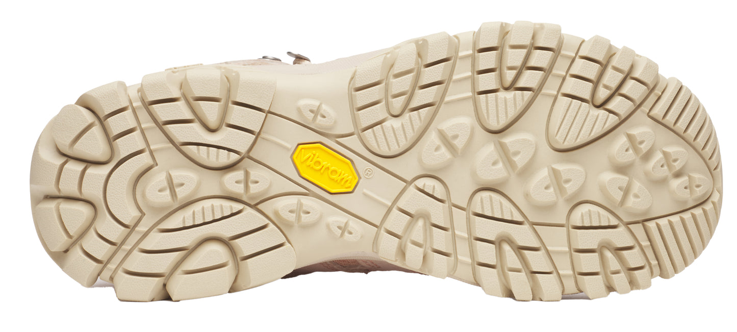 Tan shoe sole with yellow Vibram brand logo and deep treads.