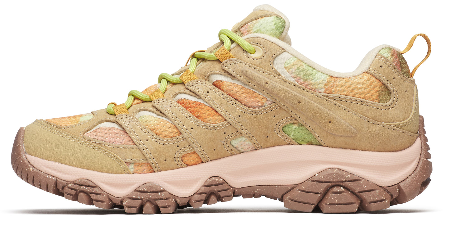 Low profile athletic shoe, tan suede leather and orange, yellow and green floral patterned mesh upper, pink sculpted lug sole and light green laces.