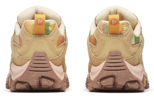 A pair of running shoes with tan bodies, multi-colored heels, orange pull tabs, and brown soles.