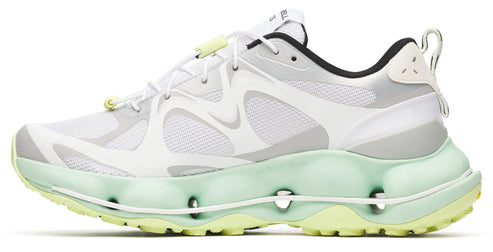Low-top white running shoe with green and yellow sole.
