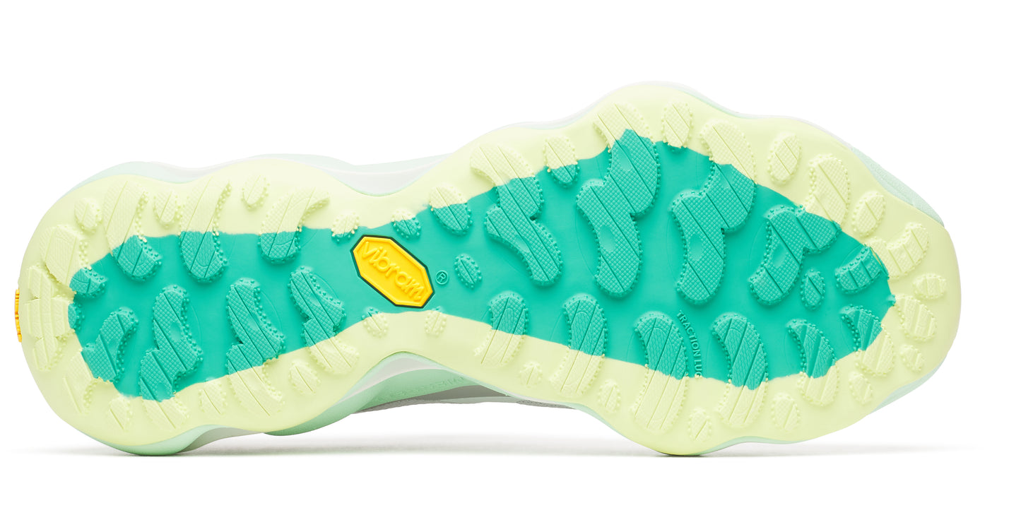 Shoe sole in mint and light yellow with a textured Vibram design.