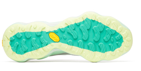Shoe sole in mint and light yellow with a textured Vibram design.