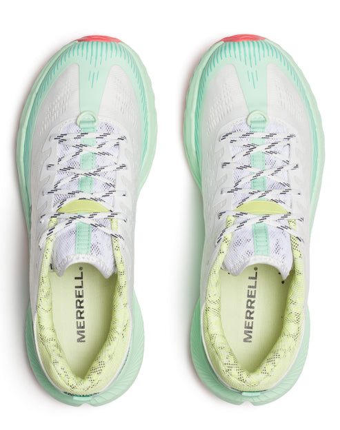 Top-down view of two athletic shoes with white uppers, patterned laces, light green soles, and “MERRELL” printed on the insoles.