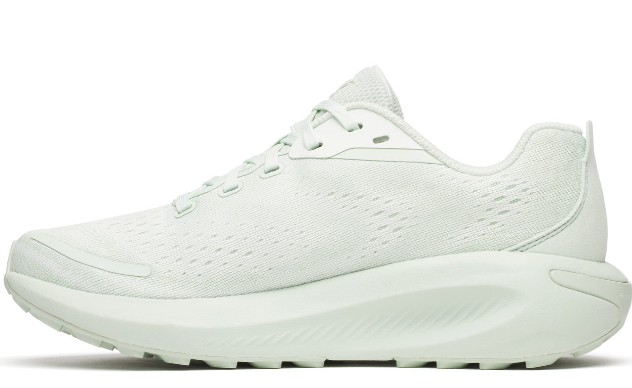 A side-profile view of a running shoe that is all-white with a thick sole and a mesh upper.