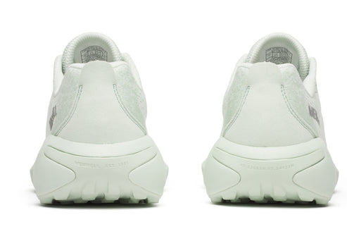 Back view of two identical, light green running shoes with thick textured soles.