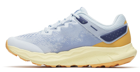 A side-view of a light blue trail running shoe with a yellow sole and orange tread.